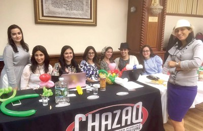 CHAZAQ staff members at the Yeshiva open house event